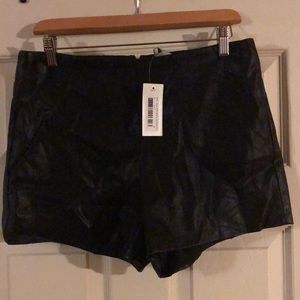 Black quilted zipper shorts